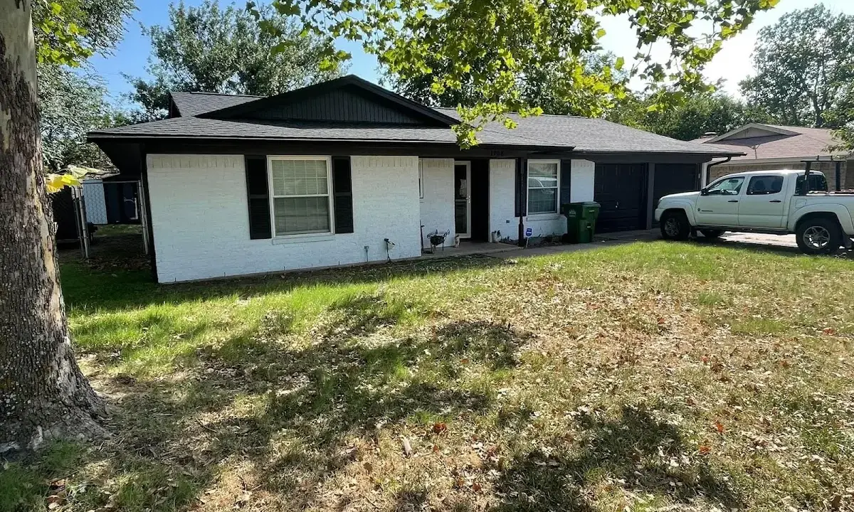 Professional roofing crew working on a residential roof in Iowa Park